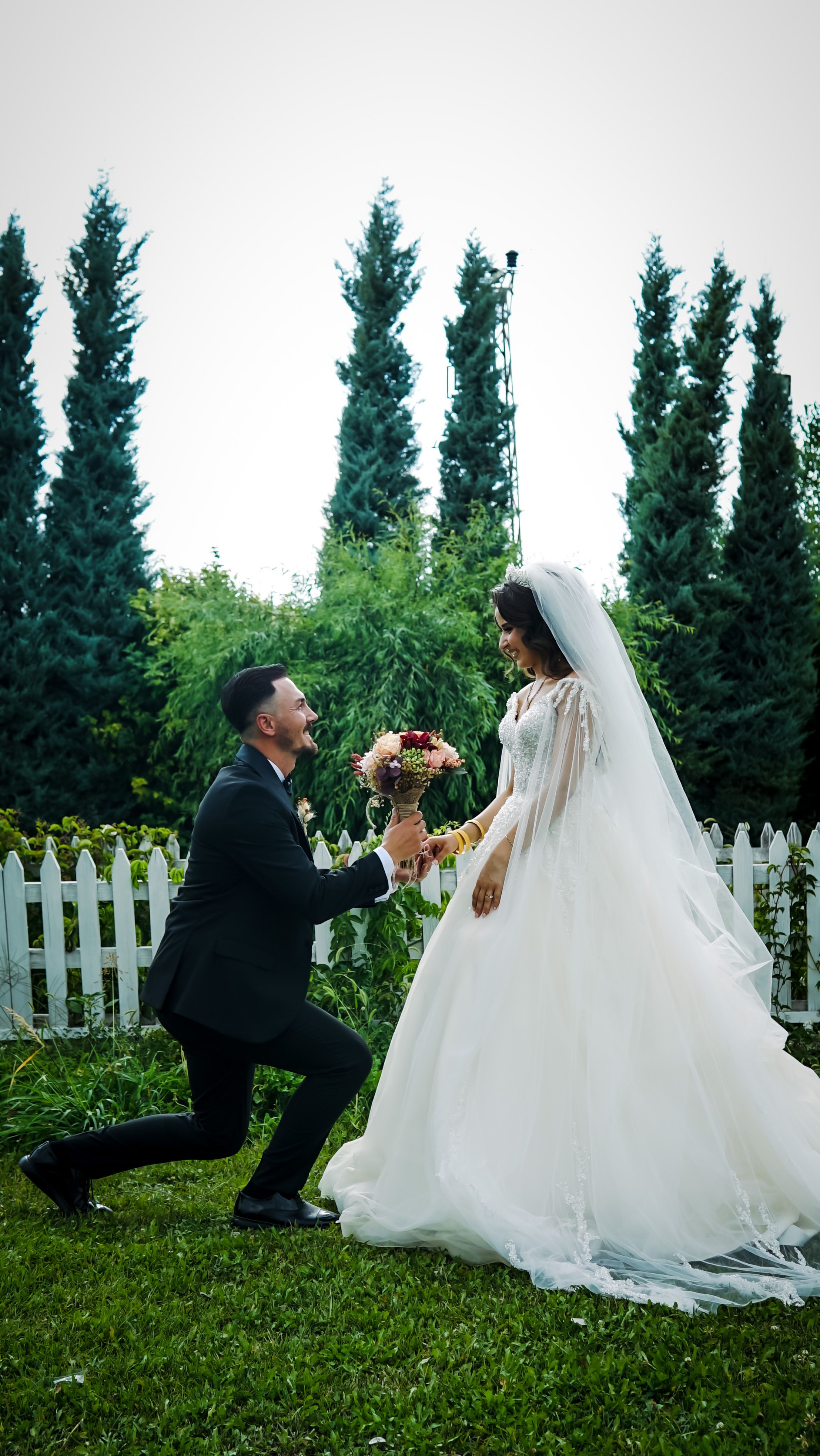 A bride and groom in a quiet garden moment — it only exists because you do